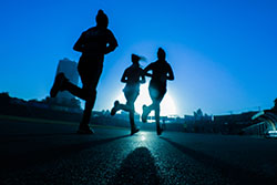 Photo: Female group running on the road