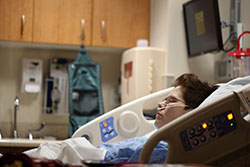 Photo: Woman in hospital bed