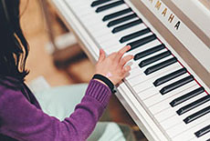 Photo: Girl playing Piano