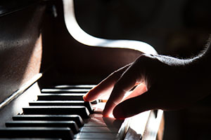 Photo: Fingers playing Piano